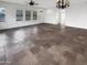 Spacious living room featuring tile flooring, ceiling fan and multiple windows for natural light at 12644 N 152Nd Ave, Surprise, AZ 85379