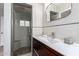 Updated bathroom with a glass enclosed shower, stylish vanity, and modern finishes at 1316 E Vermont Ave, Phoenix, AZ 85014