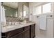 Elegant bathroom features a double sink vanity, modern fixtures, and decorative tiling at 1316 E Vermont Ave, Phoenix, AZ 85014