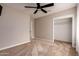 Bedroom features neutral carpet, a ceiling fan, and a convenient closet for easy storage at 1316 E Vermont Ave, Phoenix, AZ 85014