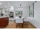 Bright dining area with modern chandelier and built-in stainless appliances at 1316 E Vermont Ave, Phoenix, AZ 85014