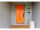 Charming residence featuring a stylish orange front door and modern brick exterior at 1316 E Vermont Ave, Phoenix, AZ 85014