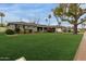 Captivating home with a well-kept lawn, carport, and mature trees offering a picturesque setting at 1316 E Vermont Ave, Phoenix, AZ 85014