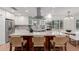 Modern kitchen with island, stainless steel appliances, and white cabinets at 1316 E Vermont Ave, Phoenix, AZ 85014