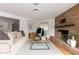 Cozy living room featuring a stone fireplace and natural light at 1316 E Vermont Ave, Phoenix, AZ 85014