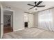 Spacious bedroom featuring a barn door leading to a renovated ensuite bathroom at 1316 E Vermont Ave, Phoenix, AZ 85014