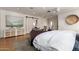 Bright main bedroom featuring a barn door, recessed lights, and stylish decor at 1316 E Vermont Ave, Phoenix, AZ 85014