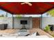 An open-air gazebo with brick flooring and patio furniture for entertaining and relaxation at 1316 E Vermont Ave, Phoenix, AZ 85014