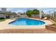 An inviting swimming pool with sunbathing lounge chairs surrounded by landscaped yard at 1316 E Vermont Ave, Phoenix, AZ 85014