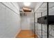 Bright walk-in closet offering ample storage space with wire shelving and wooden floor at 1316 E Vermont Ave, Phoenix, AZ 85014