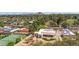 Aerial view of the property featuring a tennis court, pool, and landscaped grounds at 14814 N Coral Gables Dr, Phoenix, AZ 85023
