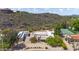 Aerial view of the property featuring a desert landscape, tennis court, and surrounding area at 14814 N Coral Gables Dr, Phoenix, AZ 85023