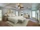 Relaxing bedroom with a tray ceiling, ceiling fan, and ensuite bathroom with walk in closet at 14814 N Coral Gables Dr, Phoenix, AZ 85023