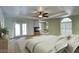 Expansive bedroom with neutral tones, a fireplace, and French doors leading to outdoor patio at 14814 N Coral Gables Dr, Phoenix, AZ 85023