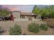 Charming single-story home with mature desert landscaping and decorative wall at 14814 N Coral Gables Dr, Phoenix, AZ 85023