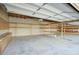 Large garage interior featuring ample open space, shelving units, and overhead lighting at 14814 N Coral Gables Dr, Phoenix, AZ 85023