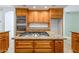 Kitchen island with gas cooktop, stainless steel double ovens, and ample cabinet space at 14814 N Coral Gables Dr, Phoenix, AZ 85023