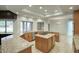 Bright kitchen featuring an island cooktop, stainless steel appliances, and granite countertops at 14814 N Coral Gables Dr, Phoenix, AZ 85023