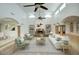 Open living room with arched ceiling, fireplace and comfortable seating at 14814 N Coral Gables Dr, Phoenix, AZ 85023