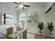 Bright home office with a modern desk, shelving, and a large window for natural light at 14814 N Coral Gables Dr, Phoenix, AZ 85023