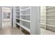 Walk-in pantry featuring ample shelving for organized storage and pantry at 14814 N Coral Gables Dr, Phoenix, AZ 85023