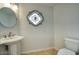 Powder room featuring decorative mirror and classic style sink and faucet at 14814 N Coral Gables Dr, Phoenix, AZ 85023