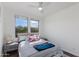 Bright bedroom with a ceiling fan and two large windows at 15221 N Clubgate Dr # 2132, Scottsdale, AZ 85254