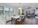 Bright, open-concept dining and living area with stylish lighting and hardwood floors at 15221 N Clubgate Dr # 2132, Scottsdale, AZ 85254