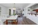 Bright, open-concept dining and living area with stylish lighting and hardwood floors at 15221 N Clubgate Dr # 2132, Scottsdale, AZ 85254