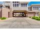 Inviting exterior of a multi-story townhome featuring stucco and a covered car port at 15221 N Clubgate Dr # 2132, Scottsdale, AZ 85254