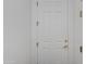 Modern white front door with brushed brass hardware, offering security and style at 15221 N Clubgate Dr # 2132, Scottsdale, AZ 85254