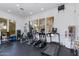 An indoor community gym includes exercise machines, weights, and a treadmill, providing residents with fitness opportunities at 15221 N Clubgate Dr # 2132, Scottsdale, AZ 85254