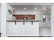 Eat in kitchen boasts breakfast bar, microwave, and dark wood cabinets at 15221 N Clubgate Dr # 2132, Scottsdale, AZ 85254