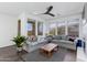 Inviting living room featuring neutral paint, ceiling fan, wood floors, and lots of natural light at 15221 N Clubgate Dr # 2132, Scottsdale, AZ 85254