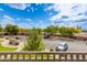 Upstairs balcony view overlooking ample community parking and lush green landscaping at 15221 N Clubgate Dr # 2132, Scottsdale, AZ 85254