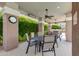 Outdoor dining patio featuring tables, chairs, and overhead lighting creates an inviting space for residents to relax at 15221 N Clubgate Dr # 2132, Scottsdale, AZ 85254