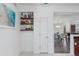Bright storage area with stylish shelving, complementing the home's decor with a beach-themed art piece at 15221 N Clubgate Dr # 2132, Scottsdale, AZ 85254