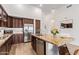 Kitchen showcasing stainless steel appliances, granite countertops, and pendant lighting above a kitchen island at 15550 S 5Th Ave # 140, Phoenix, AZ 85045