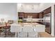 Modern kitchen featuring granite countertops, stainless steel appliances, and a large island with bar seating at 15550 S 5Th Ave # 140, Phoenix, AZ 85045