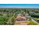 An exterior view of a spacious single-Gathering home with mature trees in a serene neighborhood at 1637 S Los Alamos Cir, Mesa, AZ 85204