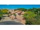 Aerial view highlighting the property's curb appeal and mature landscaping at 1637 S Los Alamos Cir, Mesa, AZ 85204
