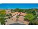 Aerial view showcasing the property, detached garage, and mature landscaping at 1637 S Los Alamos Cir, Mesa, AZ 85204
