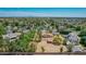 A residence surrounded by mature trees in a quiet neighborhood with mountain views at 1637 S Los Alamos Cir, Mesa, AZ 85204