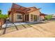 Back patio with a pergola, view of the backyard and a large window at 1637 S Los Alamos Cir, Mesa, AZ 85204