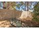 Backyard with a unique rock feature and well-maintained block fence at 1637 S Los Alamos Cir, Mesa, AZ 85204