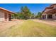 Large backyard with trees, horse property, outbuildings, and mature landscaping at 1637 S Los Alamos Cir, Mesa, AZ 85204