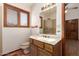 Bathroom with vanity sink, mirror, and window at 1637 S Los Alamos Cir, Mesa, AZ 85204