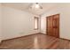 Bedroom with windows, ceiling fan, and hardwood floors at 1637 S Los Alamos Cir, Mesa, AZ 85204