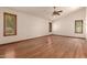 Large bedroom with hardwood floors and neutral walls at 1637 S Los Alamos Cir, Mesa, AZ 85204