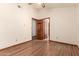 Bedroom with hardwood floors and open doorway at 1637 S Los Alamos Cir, Mesa, AZ 85204